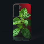 "Vivid Mint Plant Macro – Botanical Green on Black Samsung Galaxy S22 Case<br><div class="desc">Bring a breath of freshness and nature’s elegance into your space with this vivid macro photograph of a mint plant. Captured in stunning detail, the crisp green leaves pop dramatically against a moody black background with a striking red gradient. Ideal for kitchen decor, herbal-themed gifts, botanical lovers, or anyone who...</div>