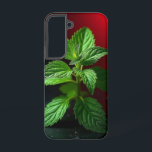 "Vivid Mint Plant Macro – Botanical Green on Black Samsung Galaxy S22 Case<br><div class="desc">Bring a breath of freshness and nature’s elegance into your space with this vivid macro photograph of a mint plant. Captured in stunning detail, the crisp green leaves pop dramatically against a moody black background with a striking red gradient. Ideal for kitchen decor, herbal-themed gifts, botanical lovers, or anyone who...</div>
