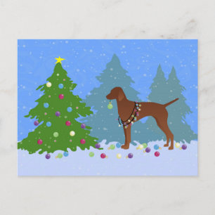 Vizsla Decorating a Christmas Tree in the Forest Holiday Postcard