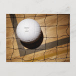 Volleyball and net on hardwood floor of postcard