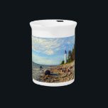 Vormsi Stillness Beverage Pitcher<br><div class="desc">This artwork captures the quiet strength and timeless presence of Vormsi, a small Estonian island in the Baltic Sea. At its center stands the Saxby Lighthouse — not as a symbol of grandeur, but as a calm, steady guide surrounded by coastal silence. The composition draws on soft natural tones, minimal...</div>