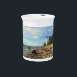 Vormsi Stillness Beverage Pitcher<br><div class="desc">This artwork captures the quiet strength and timeless presence of Vormsi, a small Estonian island in the Baltic Sea. At its center stands the Saxby Lighthouse — not as a symbol of grandeur, but as a calm, steady guide surrounded by coastal silence. The composition draws on soft natural tones, minimal...</div>