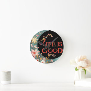 Wall clock with Life is Good text.