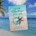 Warm Christmas Greetings Starfish Beach Scene Holiday Card<br><div class="desc">Beach scene and starfish flat "warm Christmas" greeting cards.  Tropical turquoise water,  surf and sand is the backdrop for greeting and signature.  "Christmas" can easily be changed to "seasons" or "holiday".  A brown sea star with round tree ornament is the image.  Reverse is solid aqua blue.</div>