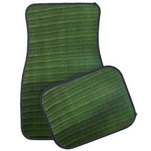 Water droplets on green leaf car floor mat