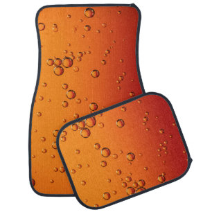 Water droplets on orange surface car floor mat