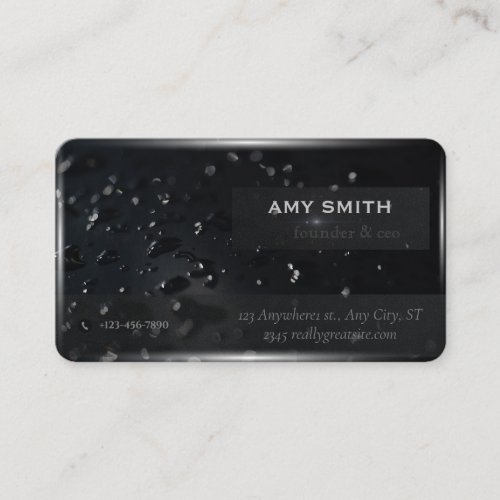 Water droplets on the background of black space business card