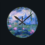 Water Lilies 1 Round Clock<br><div class="desc">Water Lilies is a series of more than 200 oil paintings by French Impressionist Claude Monet (1840–1926). The paintings which are on display in museums around the world, depict Monet's flower garden at Giverny. During the last 30 years of his life, these paintings were Monet's main focus, many of which...</div>