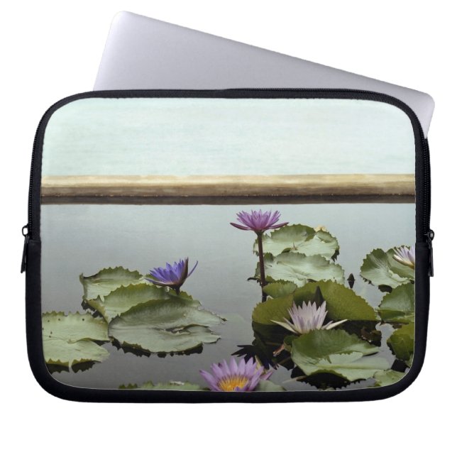 Water lilies in pond by ocean laptop sleeve (Front)