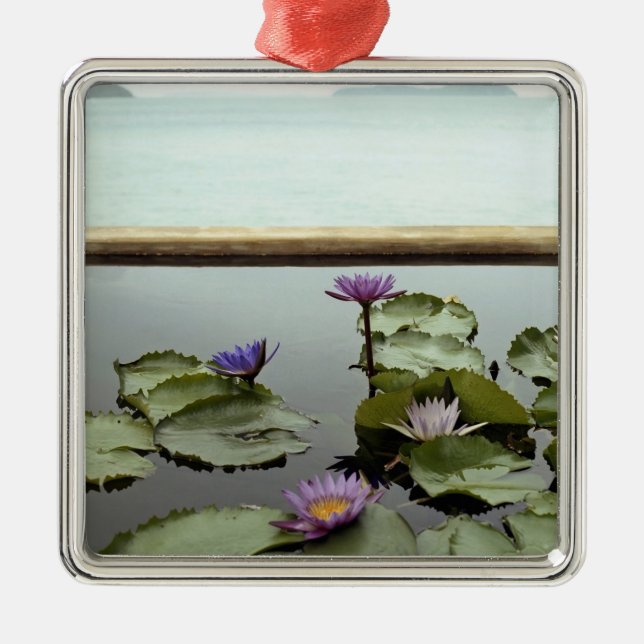 Water lilies in pond by ocean metal ornament (Front)