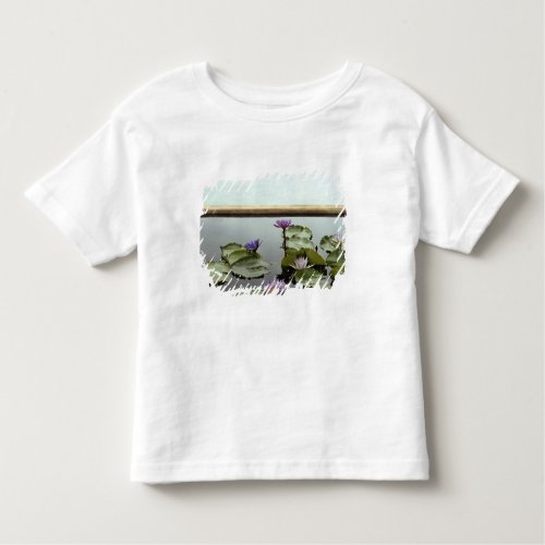 Water lilies in pond by ocean toddler t_shirt