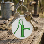 Water Pump Keychain<br><div class="desc">This design is one of those old fashioned looking water pumps. The kind where you pump a handle to draw the water. This water pump is green and is standing there just waiting for someone to come along and start pumping water. This water pump design looks great on this keychain....</div>