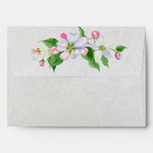 watercolor apple blossom on creased paper envelope