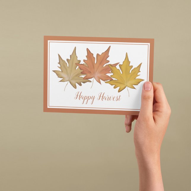Watercolor Autumn Leaves Happy Harvest Holiday Card (Autumn greeting card featuring watercolor maple leaves and a warm Happy Harvest message.)