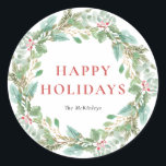 Watercolor Christmas Foliage & Holly Wreath Classic Round Sticker<br><div class="desc">Send holiday cheer with this greenery holiday sticker. It features watercolor illustrations of hollies,  pine needles and eucalyptus and evergreen with classic typography. Personalize by adding your own text. This watercolor holiday sticker will be perfect for Christmas gifts and party favors. Matching items are available.</div>