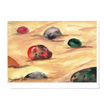 Watercolor colorful pebbles on a sandy beach