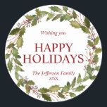 Watercolor Holly Leaves Wreath Christmas Holidays Classic Round Sticker<br><div class="desc">Lovely festive hand painted watercolor wreath holly in green and deep red berry colors.  Easy to edit  text.  HAPPY HOLIDAYS or MERRY CHRISTMAS & HAPPY NEW YEAR.  Makes great cards to send to family and friends during the holiday season - great keepsake!</div>