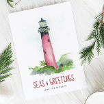 Watercolor Lighthouse Florida Beach Christmas Holiday Card<br><div class="desc">This Coastal theme Christmas card features my original hand painted watercolor Jupiter, Florida lighthouse with a string of garland in shades of red and green on a crisp white background. The words Seas and Greetings are set in a modern brush script typography in berry red. The inside features a solid...</div>