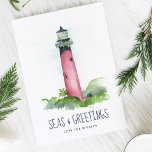 Watercolor Lighthouse Florida Beach Christmas Holiday Card<br><div class="desc">This Coastal theme Christmas card features my original hand painted watercolor Jupiter, Florida lighthouse in shades of red on a crisp white background. The words Seas and Greetings are set in a modern brush script typography in navy blue. The inside features a solid blue color with your custom greeting in...</div>