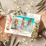 Watercolor Mele Kalikimaka Hawaiian Photo  Holiday Card<br><div class="desc">Modern holiday photo card features "Mele Kalikimaka, " the Hawaiian Christmas greeting,  with watercolor tropical foliage,  exotic hibiscus flowers,  baubles and a gold ribbon pineapple framing your favorite beach or vacation photo. All text is easily customized using the template provided.</div>