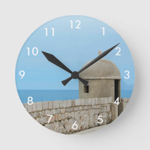 Watercolor painting of Dubrovnik city wall Round Clock
