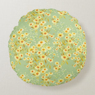 Watercolor picture of daisy flowers on a light gre round pillow