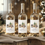 Watercolor Rustic Gnome Merry Christmas Wine Label<br><div class="desc">These cozy, rustic holiday wine labels feature a watercolor illustration of a cute female gnome seated next to a miniature Christmas tree, a basket of birch logs, and some candles. The words "MERRY CHRISTMAS" appear in gray serif letters that coordinate with the art. Add your family's name in charcoal gray...</div>