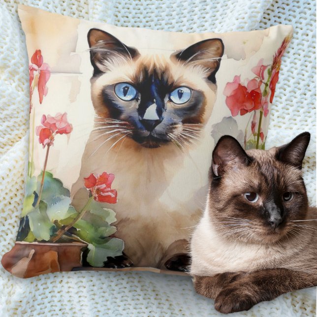 Watercolor Siamese Cat with Red Geranium Flowers Throw Pillow (A pillow cushion with illustration of a Siamese cat with red geraniums in a watercolor style)