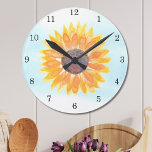 Watercolor Sunflower Round Clock<br><div class="desc">This floral walk clock is decorated with a watercolor yellow sunflower and blue sky background.
Makes a perfect house warming gift.
Original Watercolor © Michele Davies.</div>