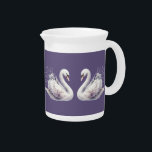Watercolor Swan with Lavender Florals Beverage Pitcher<br><div class="desc">This serene watercolor swan illustration captures a moment of quiet grace, blending the elegance of a poised white swan with the gentle beauty of blooming lavender and soft blush florals nestled within its wings. The flowing pastel tones and fine brushwork evoke a dreamy, romantic atmosphere that fits effortlessly into cottagecore...</div>