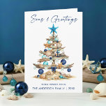 Watercolor Tree Seas and Greetings Beach Folded Holiday Card<br><div class="desc">Modern Minimalist Elegance Calligraphy Ink Pen Handwritten Script Seas & Greetings Coastal Folded Holiday Card includes a Watercolor Christmas Tree make of beach ocean driftwood,  seashells,  sand dollars,  nautical anchor ornament and topped with a starfish. Navy Blue Text.</div>