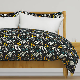 Watercolor wildflowers and leaves pattern on black duvet cover