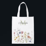 Watercolor Wildflowers Boho Stylish with Monogram Grocery Bag<br><div class="desc">A stylish reusable grocery tote with its feminine boho wildflowers design and personalized with your monogram initial and name. It features a border row of watercolor wildflowers in soft pastel hues of pink, periwinkle blue, off-white and yellow with delicate stems and greenery. A text template is included to personalize with...</div>
