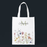 Watercolor Wildflowers Boho Stylish with Monogram Grocery Bag<br><div class="desc">A stylish reusable grocery tote with its feminine boho wildflowers design and personalized with your monogram initial and name. It features a border row of watercolor wildflowers in soft pastel hues of pink, periwinkle blue, off-white and yellow with delicate stems and greenery. A text template is included to personalize with...</div>