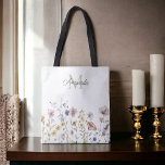 Watercolor Wildflowers Boho Stylish with Monogram Tote Bag<br><div class="desc">A stylish tote to take everywhere, this feminine boho wildflowers design has a text template to personalize with your monogram initial and name. It features a border row of watercolor wildflowers in soft pastel hues of pink, periwinkle blue, off-white and yellow with delicate stems and greenery. Great for shopping, school,...</div>