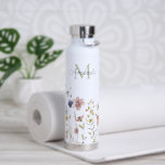 Watercolor Wildflowers Boho Stylish with Monogram Water Bottle<br><div class="desc">A stylish water bottle with its feminine boho wildflowers design and personalized with your monogram initial and name. It features a border row of watercolor wildflowers in soft pastel hues of pink, periwinkle blue, off-white and yellow with delicate stems and greenery. A text template is included to personalize with your...</div>
