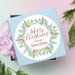 Watercolor Wreath Christmas Sticker<br><div class="desc">Add holiday cheer to your mailings or gift wrapping with my Christmas labels. Round stickers feature my original watercolor wreath of greenery and red berries on a crisp white background. The greeting Merry Christmas in modern hand hand writing script typography. To see matching designs visit www.zazzle.com/dotellabelle</div>