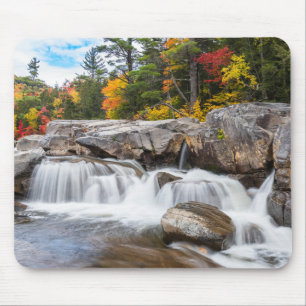 Waterfall along a mountain river in autumn mouse pad