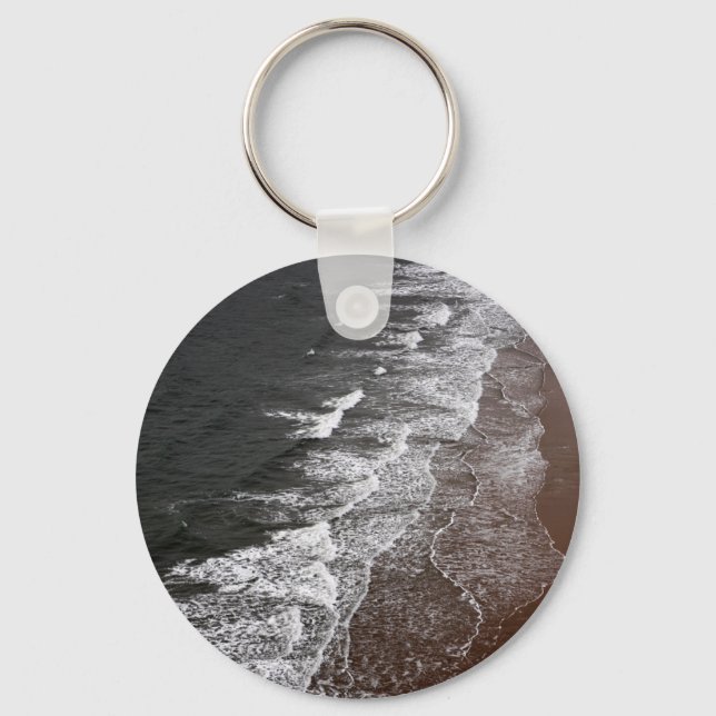 Waves breaking on a sandy beach keychain (Front)