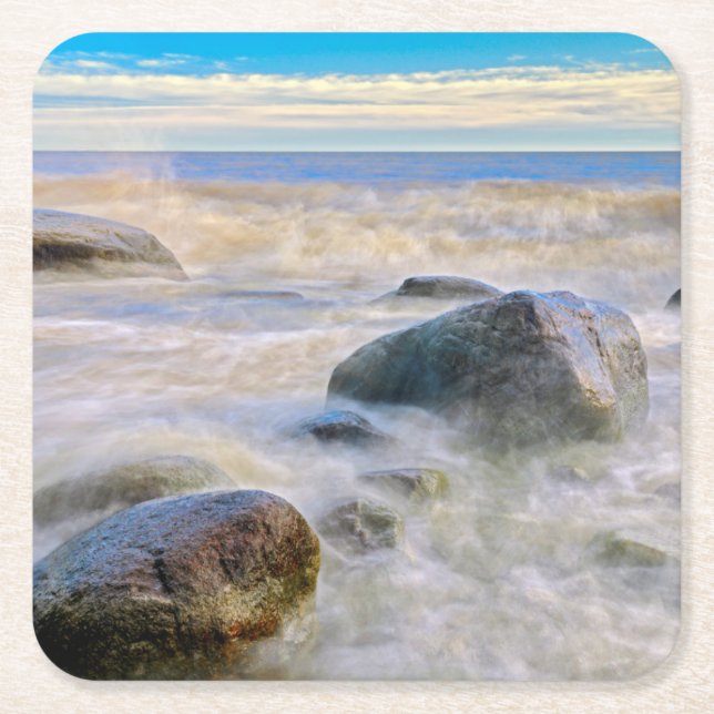 Waves crashing on shoreline rocks square paper coaster (Front)