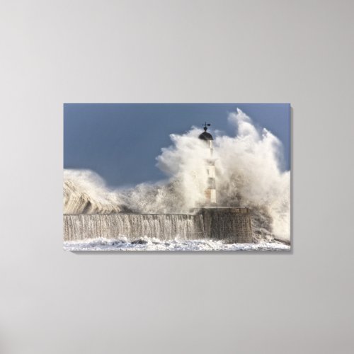 Waves Crashing Up Against A Lighthouse Canvas Print