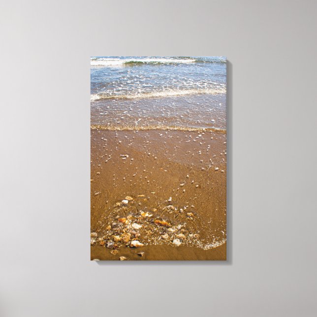 Waves Splashing Against Pebbles on a Beach Canvas Print (Front)
