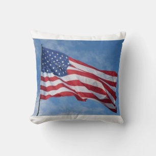 Waving American Flag Against Blue Sky Throw Pillow