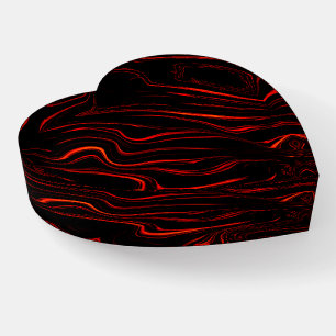 Wavy red long traces over black background  paperweight