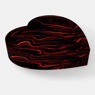 Wavy red long traces over black background  paperweight