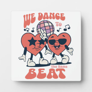 we dance to the same beat plaque
