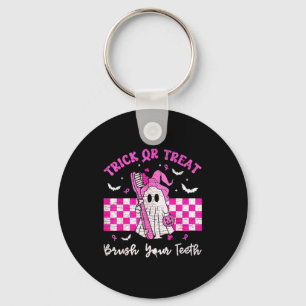 Wear a pink trick or treat brush teeth dental keychain