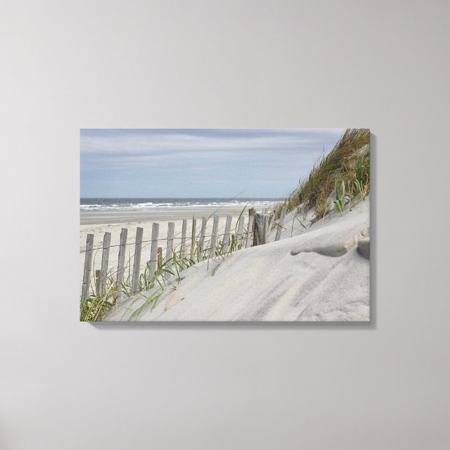 Weathered fence and sand dunes at the beach canvas print (Front)