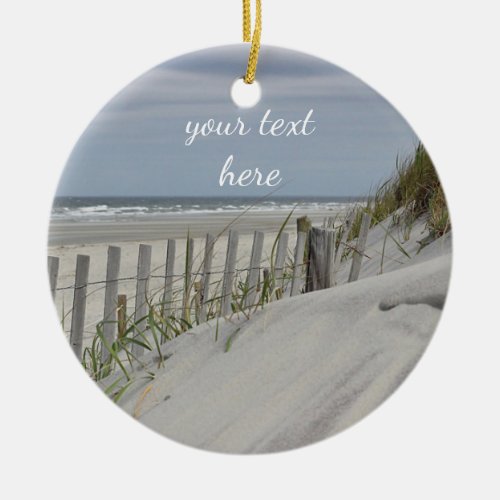 Weathered fence and sand dunes at the beach ceramic ornament