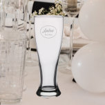 Wedding Best Man Stylized Name Pilsner Glass<br><div class="desc">Pilsner glass for the Best Man in your wedding party that features an etched, oval design with Best Man's name in stylized script. Also a great party supply idea for a bachelor party! Personalize your glass by editing and replacing Best Man's name with your own. Also available in other glassware...</div>